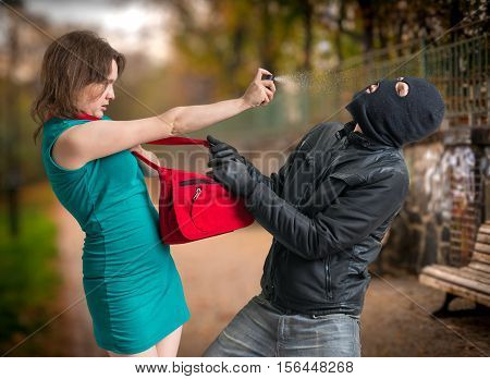Self Defense Concept. Young Woman Was Attacked By Man In Balacla