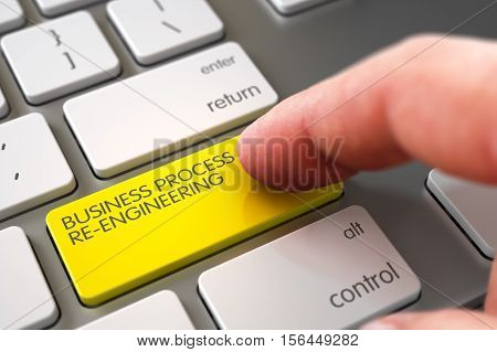 Business Concept - Male Finger Pointing Yellow Business Process Re-Engineering Key on Modern Laptop Keyboard. 3D.