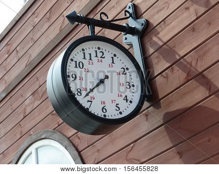 Old retro clock at a train station. The interior of the Museum of Military Equipment