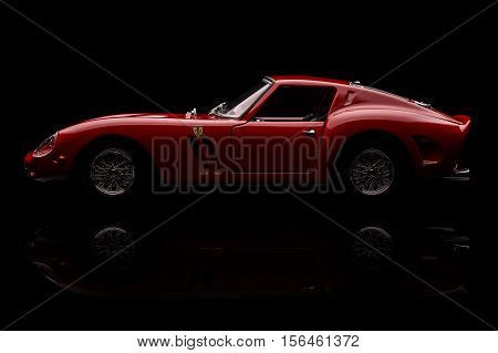KRIVOY ROG, UKRAINE - OCT 29 - Toy Ferrari 250 GTO on background. Photo made in the studio, Saturday 29 October 2016