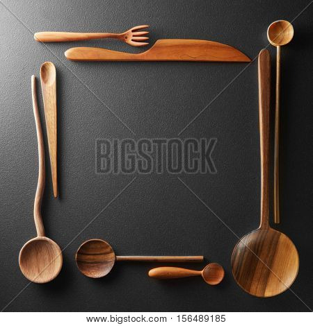 frame of wooden spoons, forks and a knife