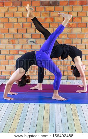 Group Of Women Doing Yoga Indoors For good health