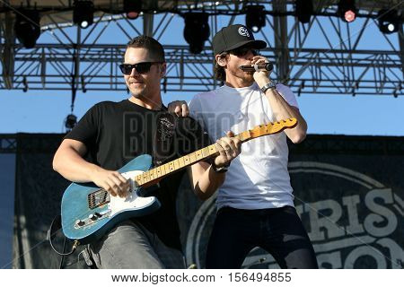 LAKE WALES, FL-NOV 4: Chris Janson (R) performs at the CountryFlo Music and Camping Festival on November 4, 2016 in Lake Wales, Florida.