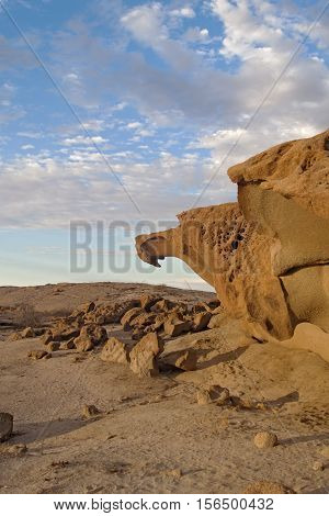 massive orange granite rock formation in sunset, Namibia