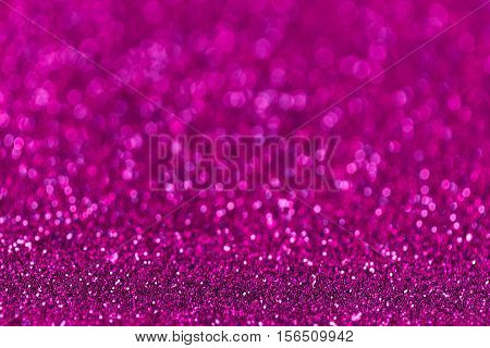 Purple sparkling background from small sequins closeup. Brilliant and diamond backdrop.