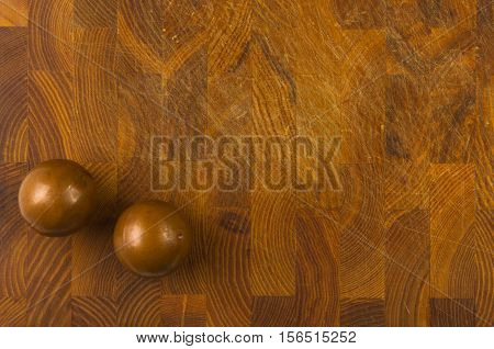 pair of copper Chinese singing balls Baoding of health for hands on wooden background