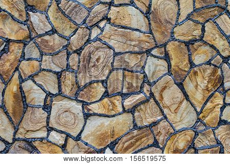 Natural stone for construction. Texture facing surface of natural stone with black seams.