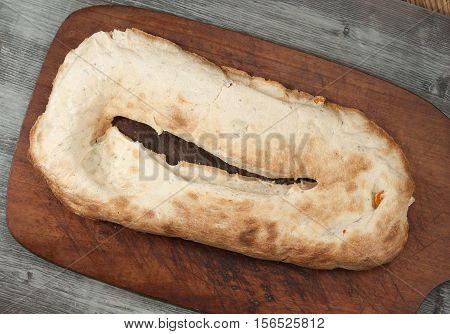 Georgian lavash with greenery and paprika on board