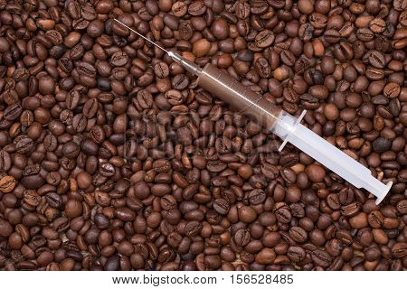 Your daily shot of coffee with a syringe on coffeebeans