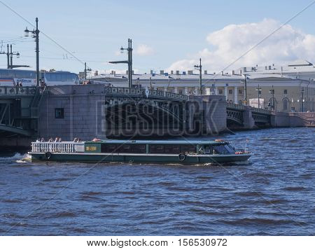 Saint Petersburg Russia Septembert 10 2016: excursion boat on the background of the Palace bridge in St. Petersburg Russia.