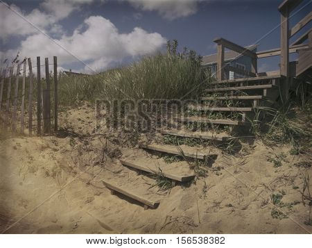 Vintage camera effect - Sand dunes and wooden stairs for beach access, Outer Banks North Carolina OBX