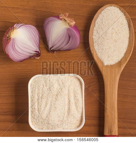 Cooking Brazilian Farofa. Manioc Flour. Farinha de Mandioca over a wooden table