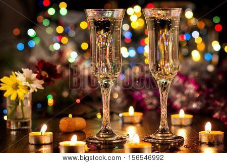 Lovely romantic dinner. Glass of champange with boken background