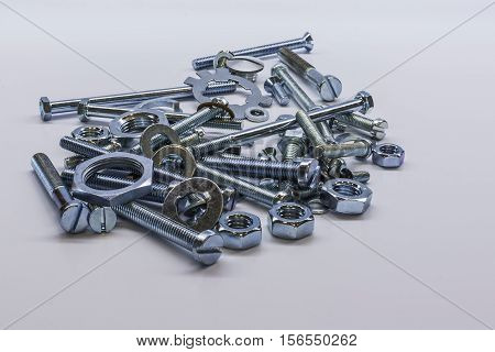Some bolts and nuts on white background