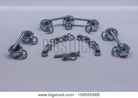 Some bolts and nuts on white background