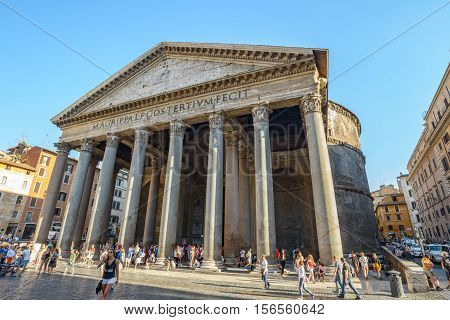 Rome Italy - August 22 2015: backside of the famous ancient church Pantheon in Rome Italy people walking in the square