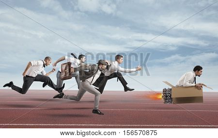 Businessman with cardboard missile overcomes and wins a race against opponents