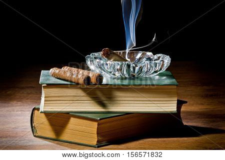 Blue Smoke From Cigar With Ashtray And Two Books Volume