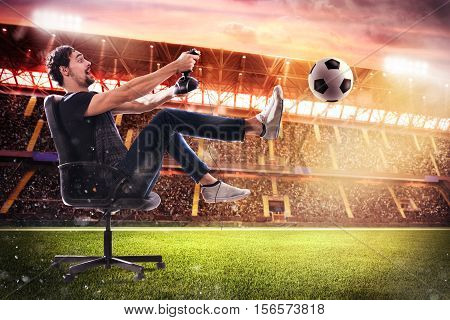 Boy with joystick plays with soccer video game