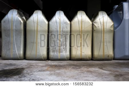 Plastic canister with blank label in a blurred background.