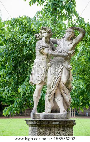 Ornamental white stone statues along the main avenue of Querini park in Vicenza
