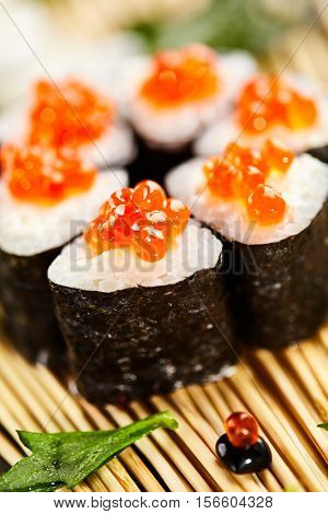 Ikura Maki Sushi - Roll with Cream Cheese inside. Topped with Ikura (Salmon Roe)