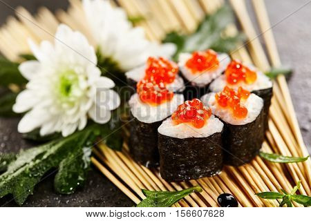 Ikura Maki Sushi - Roll with Cream Cheese inside. Topped with Ikura (Salmon Roe)