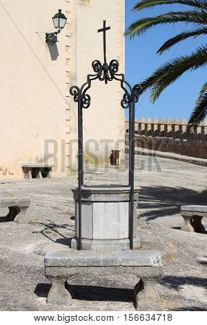 Medieval water well in Saint Salvador church in Arta, Spain
