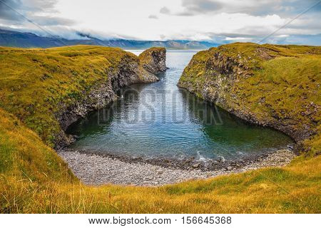 The picturesque coastal bay near the fishing village of Arnastapi. Iceland in July