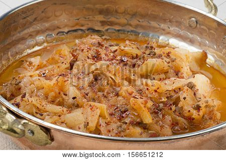 Traditional Turkish food called kapuska in copper pan.