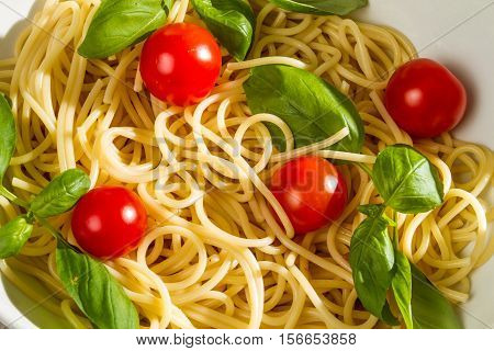 Close-up Of Pasta With Tomato And Basil