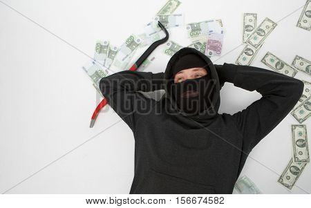Burglar lying with passkey , money