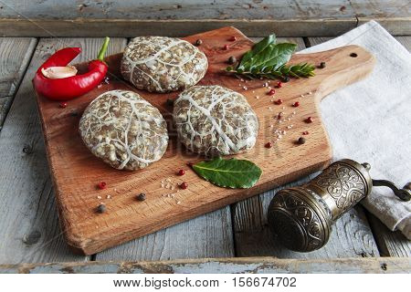 Caul-Fat Meatballs raw burger cutlet handmade on desk