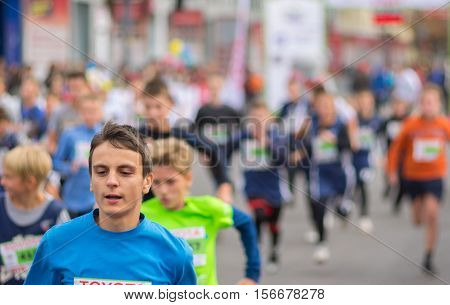 DNEPR UKRAINE - SEPTEMBER 25, 2016:Young participants hurrying to finish line during kids section of 