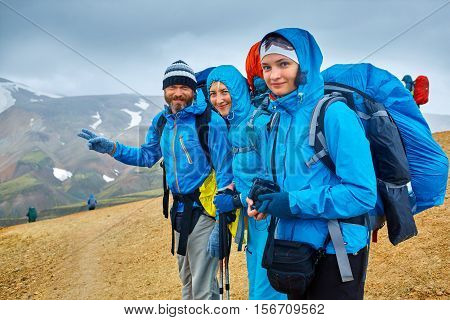 hikers on the trail in the Islandic mountains. Trek in National Park Landmannalaugar, Iceland