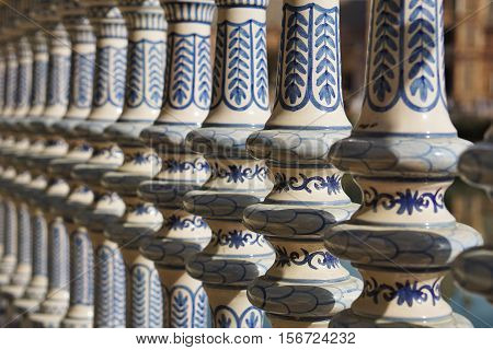Detail of a ceramic decorated railing (handrail) in Sevilla (Seville) in Southern Spain in front of the famous Plaza de Espana