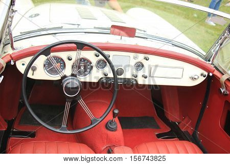a Dashboard of a vintage sports car