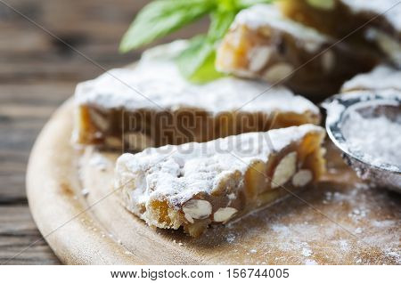 Traditional italian dessert panforte  with nut selective focus