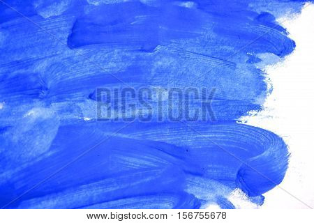uncertain chaotic backdrop. strokes of blue paint made by a finger. blue finger smears on a white background isolated. abstract background space for text base
