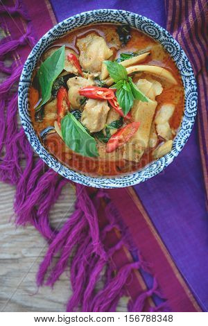 Thai Chicken Red Curry on Thai Fabric and Old Wooden Background Thai Food Thai Cuisine Thai Famouse Food