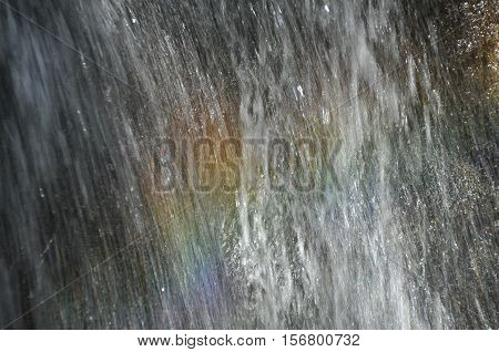 Rainbow at the waterfall Millomeris in the mountains in Cyprus