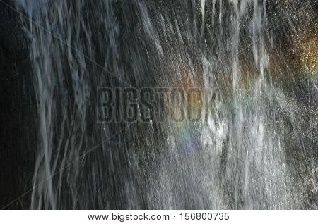 Rainbow at the waterfall Millomeris in the mountains in Cyprus