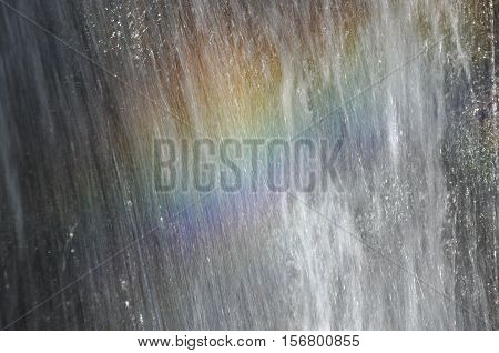 Rainbow at the waterfall Millomeris in the mountains in Cyprus