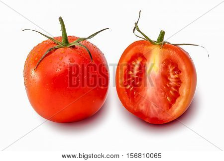Tomato and a slice of tomato on white background