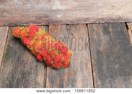 rambutan sweet fruit fresh on wood background