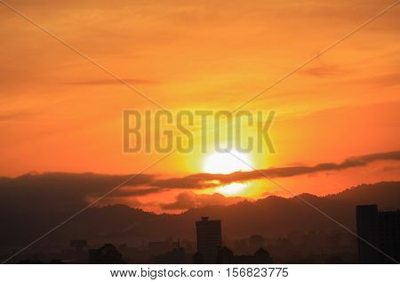 sky in sunrise and motion cloud beautiful colorful before dawn nature landscape with city silhouette