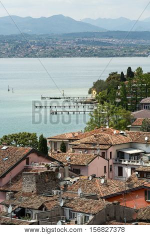 SIRMIONE ITALY - MAY 5 2016:View of colorful old building in Sirmione and Lake Garda from Scaliger castle wall Italy