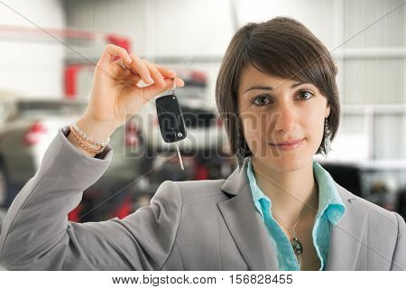 Woman servicing her car