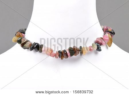 Colorful and crisp image of splintered tourmaline chain on bust