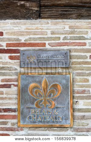 Vonnas, France - June 29, 2016: Relais and Chateaux symbol on Georges Blanc restaurant. Relais and Chateaux is a global fellowship of individually owned and operated luxury hotels and restaurants